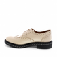LUNA SOLE PINPIN EGGNOG cream leather brogue derby shoe with a thick black speckled sole. Photo of left side view.