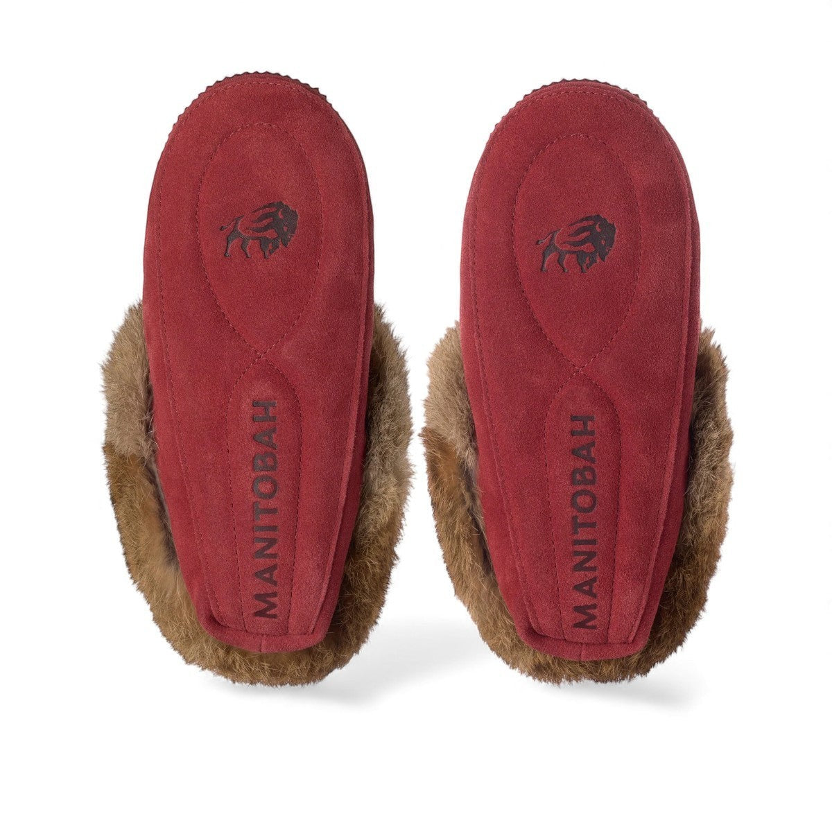 Manitobah red dahlia suede Tipi moccasin slippers with rabbit fur trim and soft suede soles, bottom view