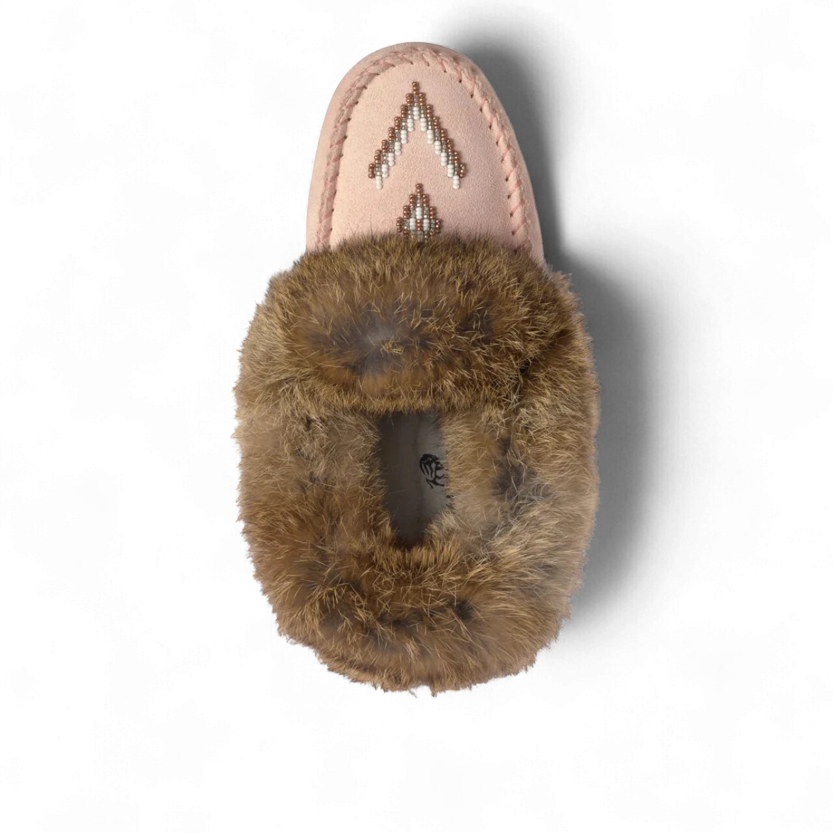 Manitobah rose suede moccasin with a beaded vamp and fluffy fur ankle cuff, top view.
