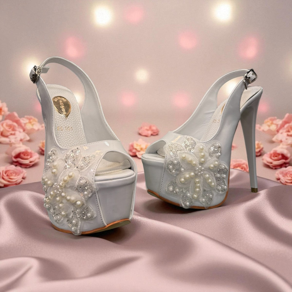 NIKPA ALEX white patent leather slingback platform heel with pearl and sequin floral embellishment