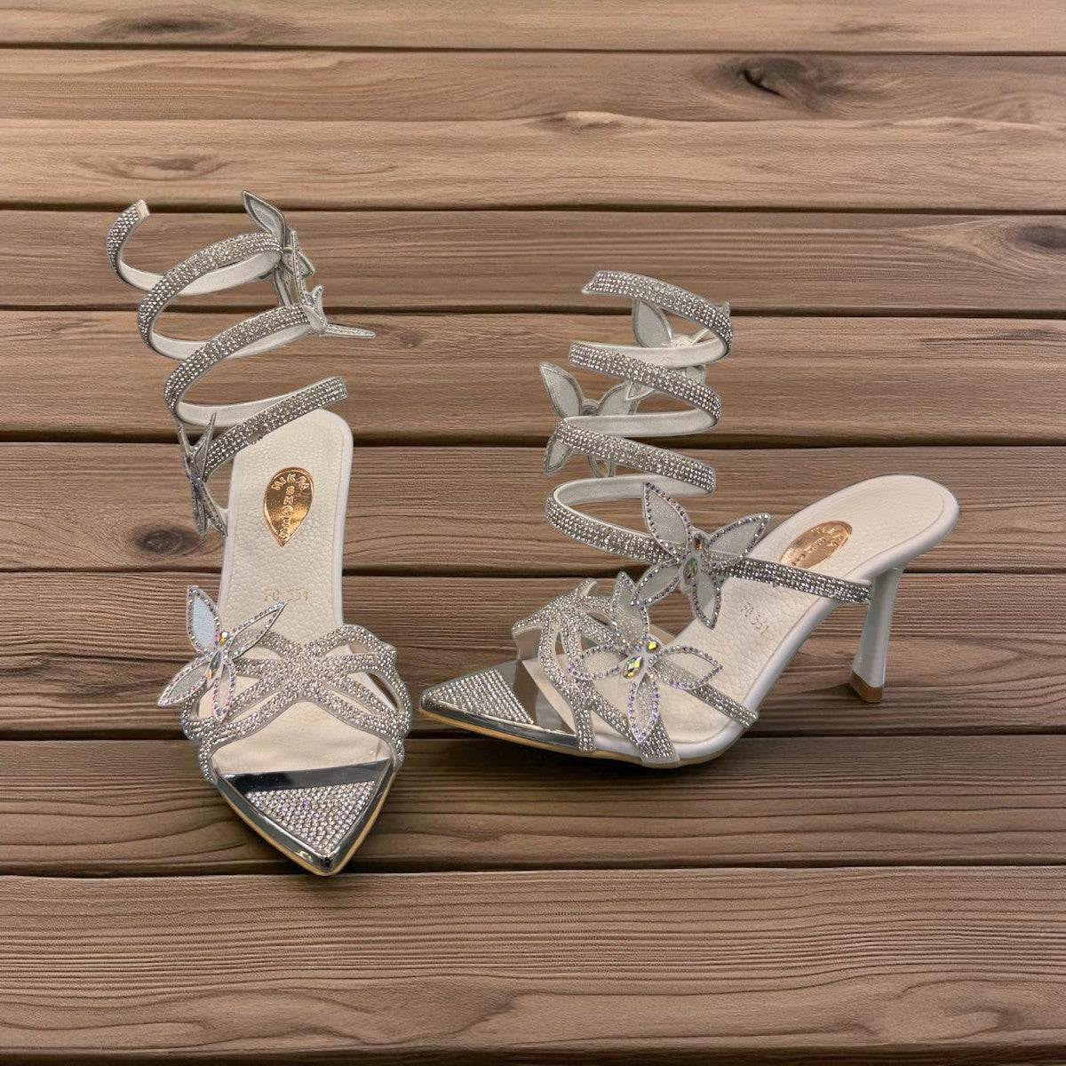 NIKPA ASHLEY white and silver stiletto sandal with rhinestone butterfly accents and spiral ankle strap