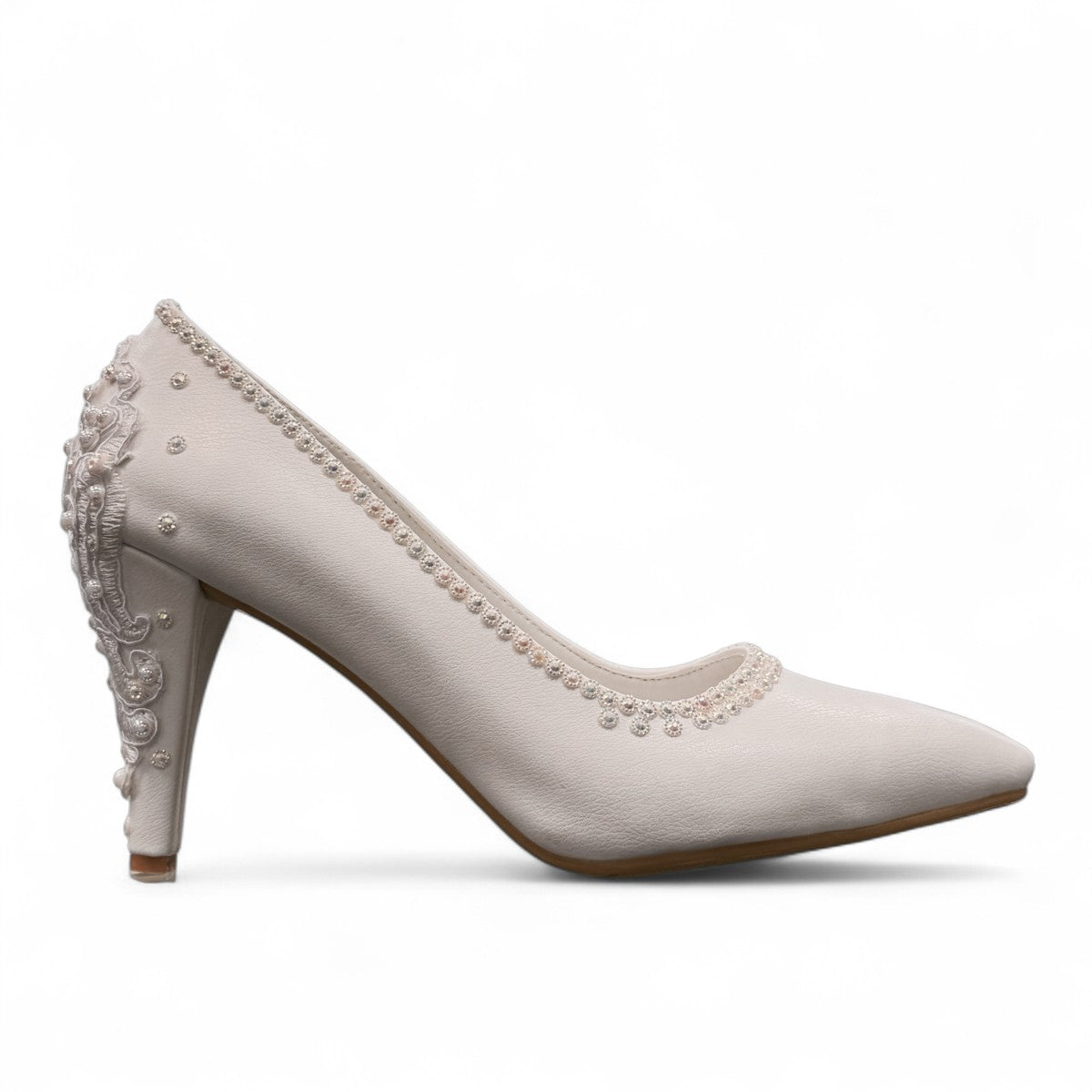 NIKPA white bridal stiletto pump with intricate pearl and bead embellishments on the heel and collar.