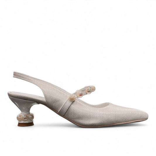 Nikpa Jayran white bridal slingback heels featuring a pointed toe and decorative pearl embellishments.