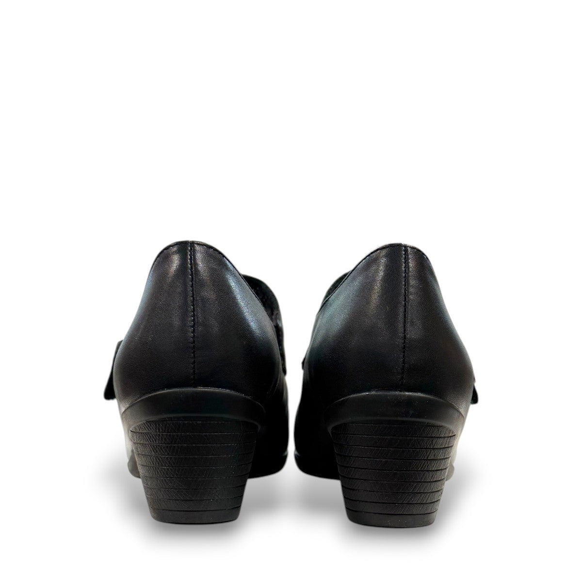 ORTHO-FLEX-F7108L black genuine leather Mary Jane shoe with an adjustable strap, metallic accent, and block heel.
photo of the back side