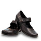 ORTHO-FLEX-F7108L black genuine leather Mary Jane shoe with an adjustable strap, metallic accent, and block heel.
photo of the front side