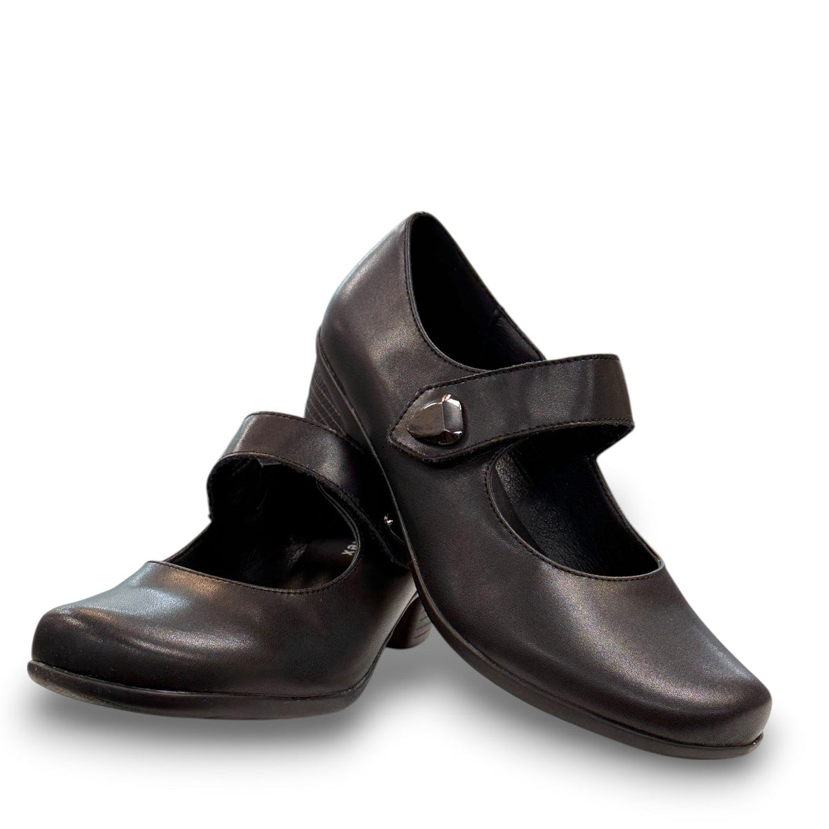 ORTHO-FLEX-F7108L black genuine leather Mary Jane shoe with an adjustable strap, metallic accent, and block heel.
photo of the front side