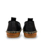 Roamers Avery black leather flat with decorative whipstitch detailing and a durable rubber sole.
photo of the back side