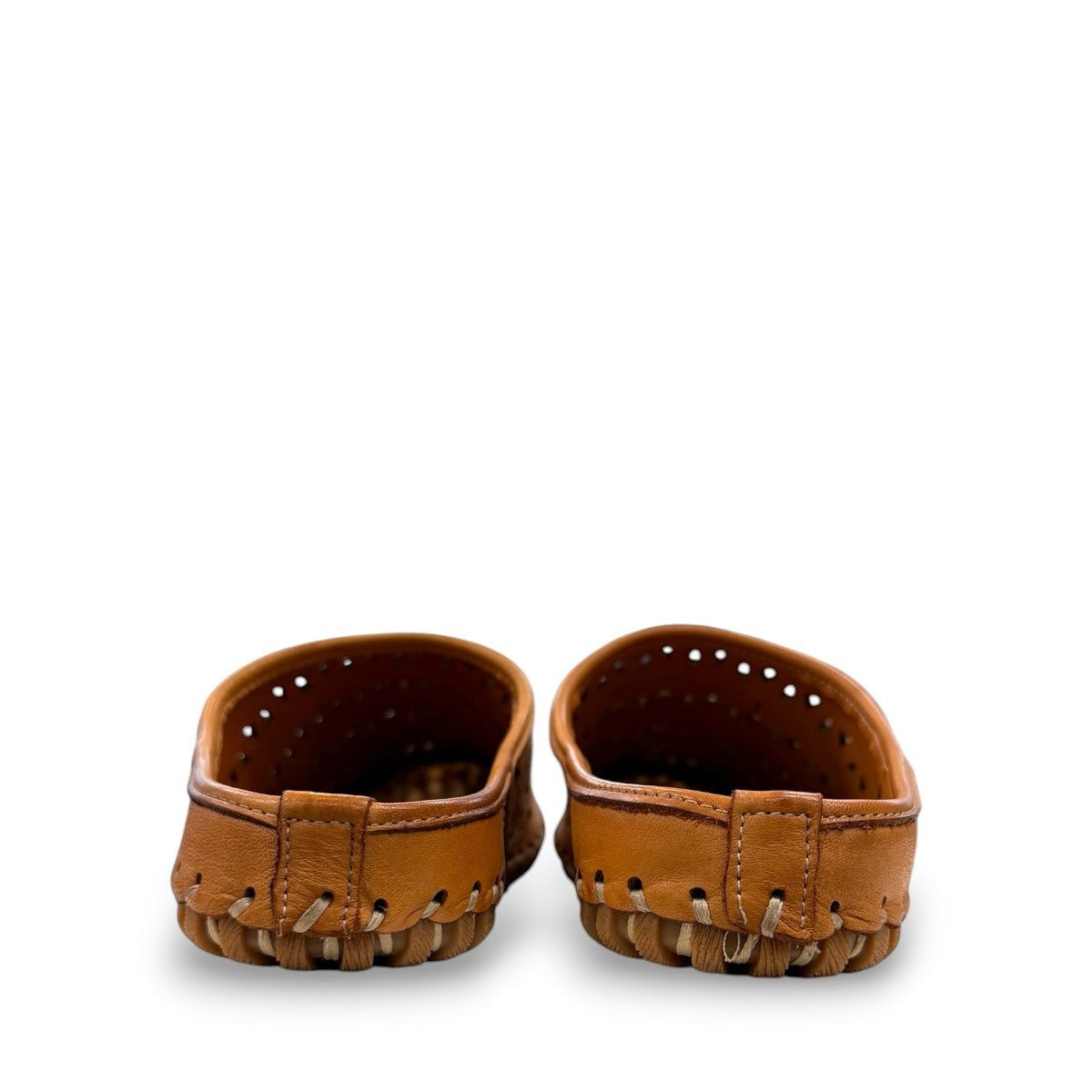 tan leather backless slip-on sandal with breathable perforated cutouts and a durable rubber outsole.
photo of the back side