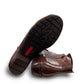 Ros Hommerson Esme brown leather ankle bootie with ruched vamp detailing and a low stacked heel.
photo of the bottom side
