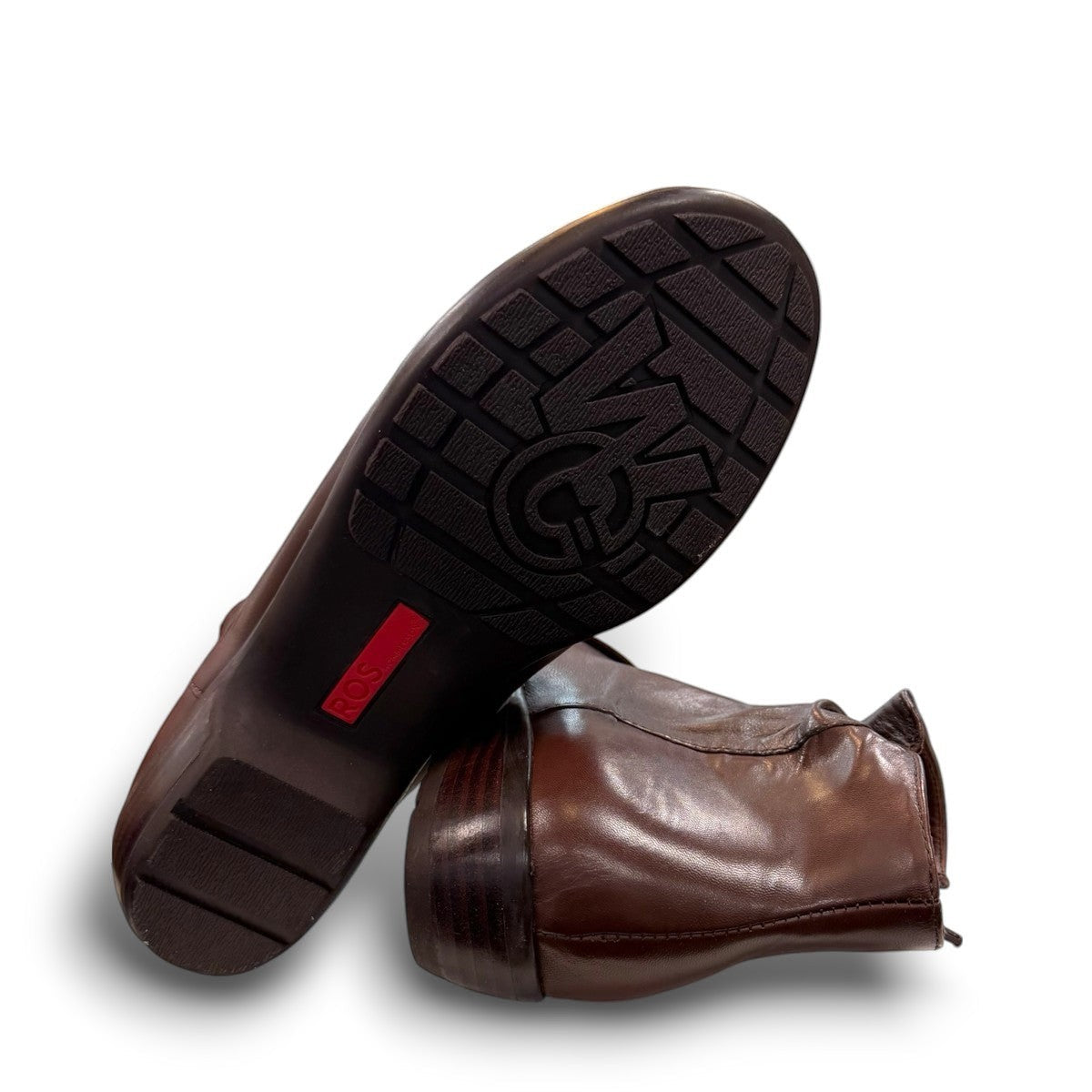 Ros Hommerson Esme brown leather ankle bootie with ruched vamp detailing and a low stacked heel.
photo of the bottom side