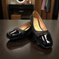 Sabatini of Florence SF1 black slip-on shoe with a glossy cap-toe and low block heel.
photo of the front side
