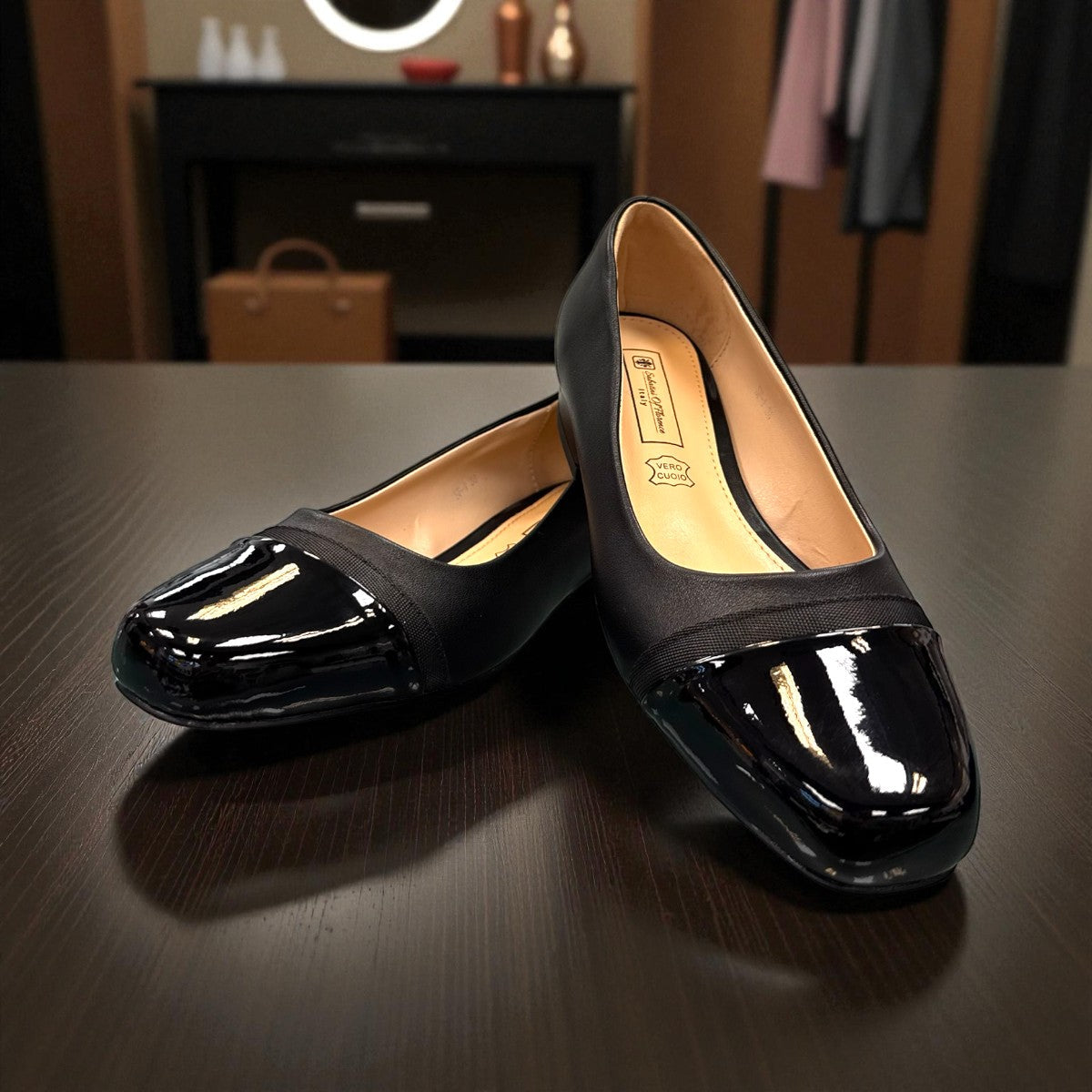 Sabatini of Florence SF1 black slip-on shoe with a glossy cap-toe and low block heel.
photo of the front side