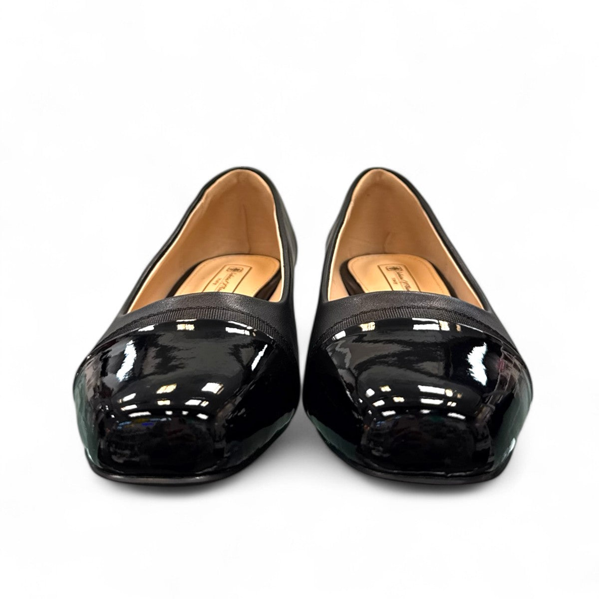 Sabatini of Florence SF1 black slip-on shoe with a glossy cap-toe and low block heel.
photo of the front side