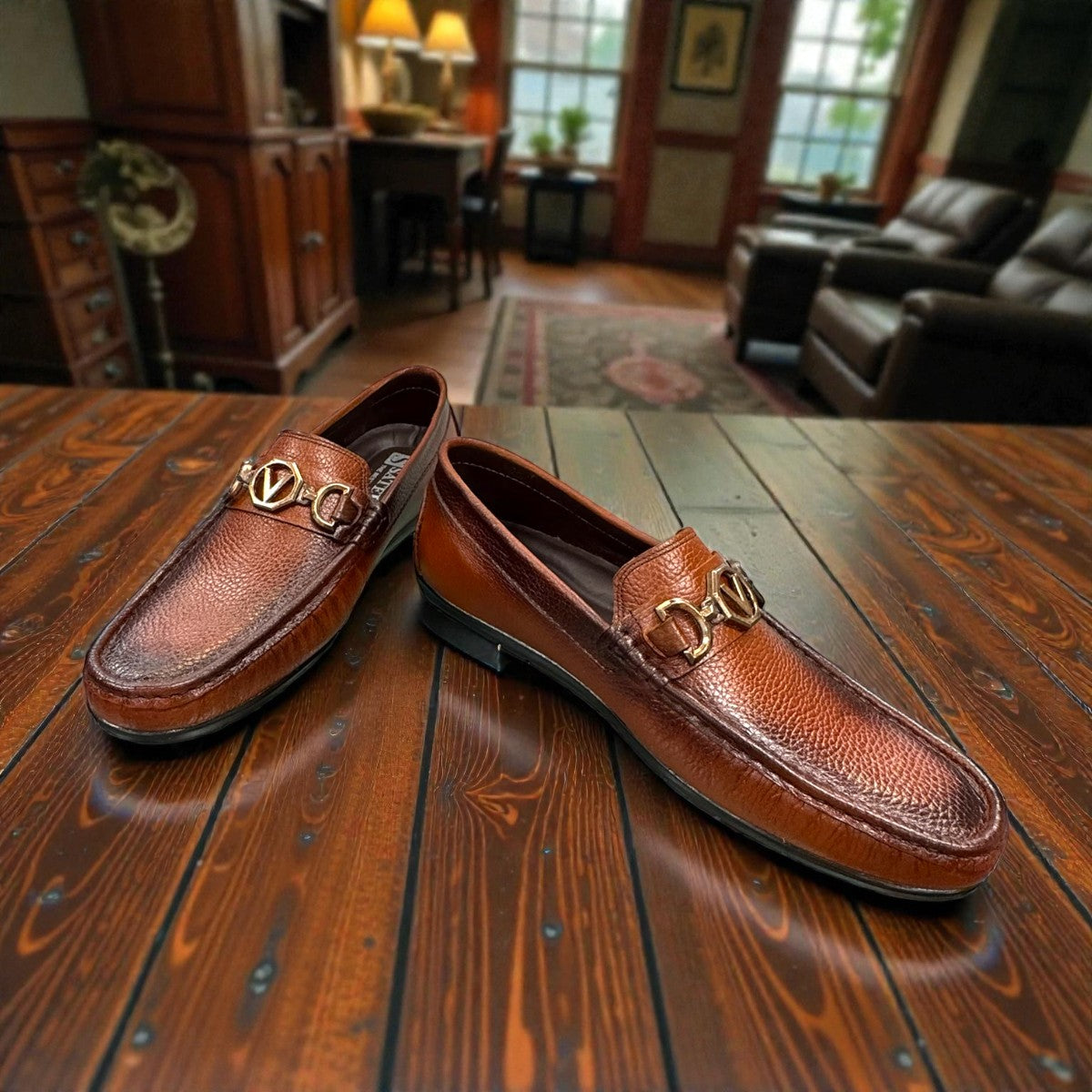 Satel Ariashahr light brown leather loafers with handmade stitching and a metallic bit detail. Photo of front view.