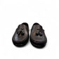 Satel Gishan black leather loafers with handmade stitching and tassel detail for formal wear. Photo of front view.
