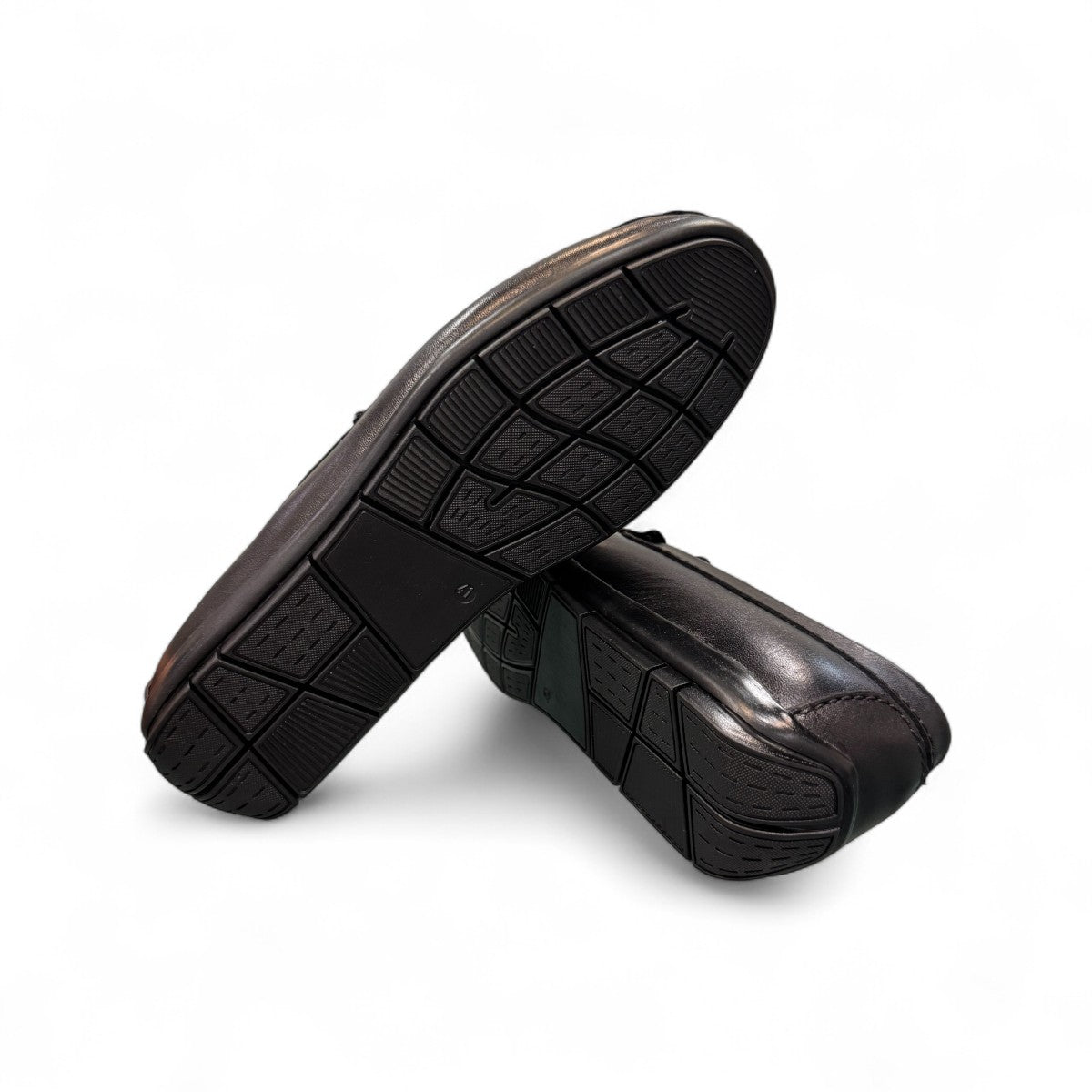 Satel Gishan black leather loafers with handmade stitching and tassel detail for formal wear. Photo of bottom view.