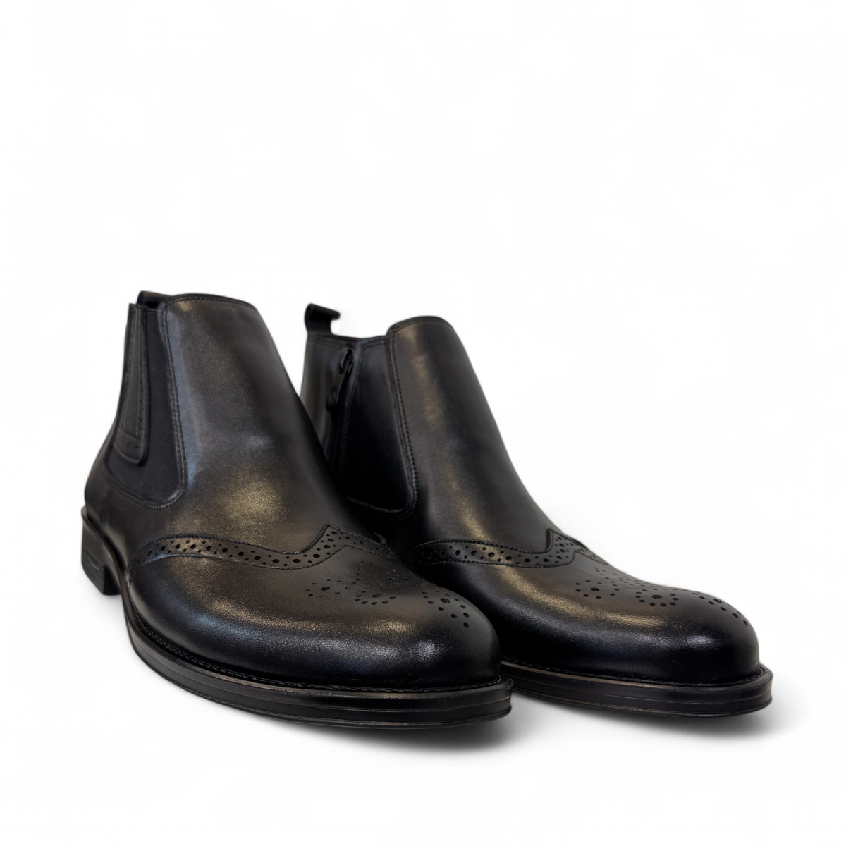 Satel Mashhad black leather boots with brogue detailing and elastic side panels on a white background. Photo of front side views.