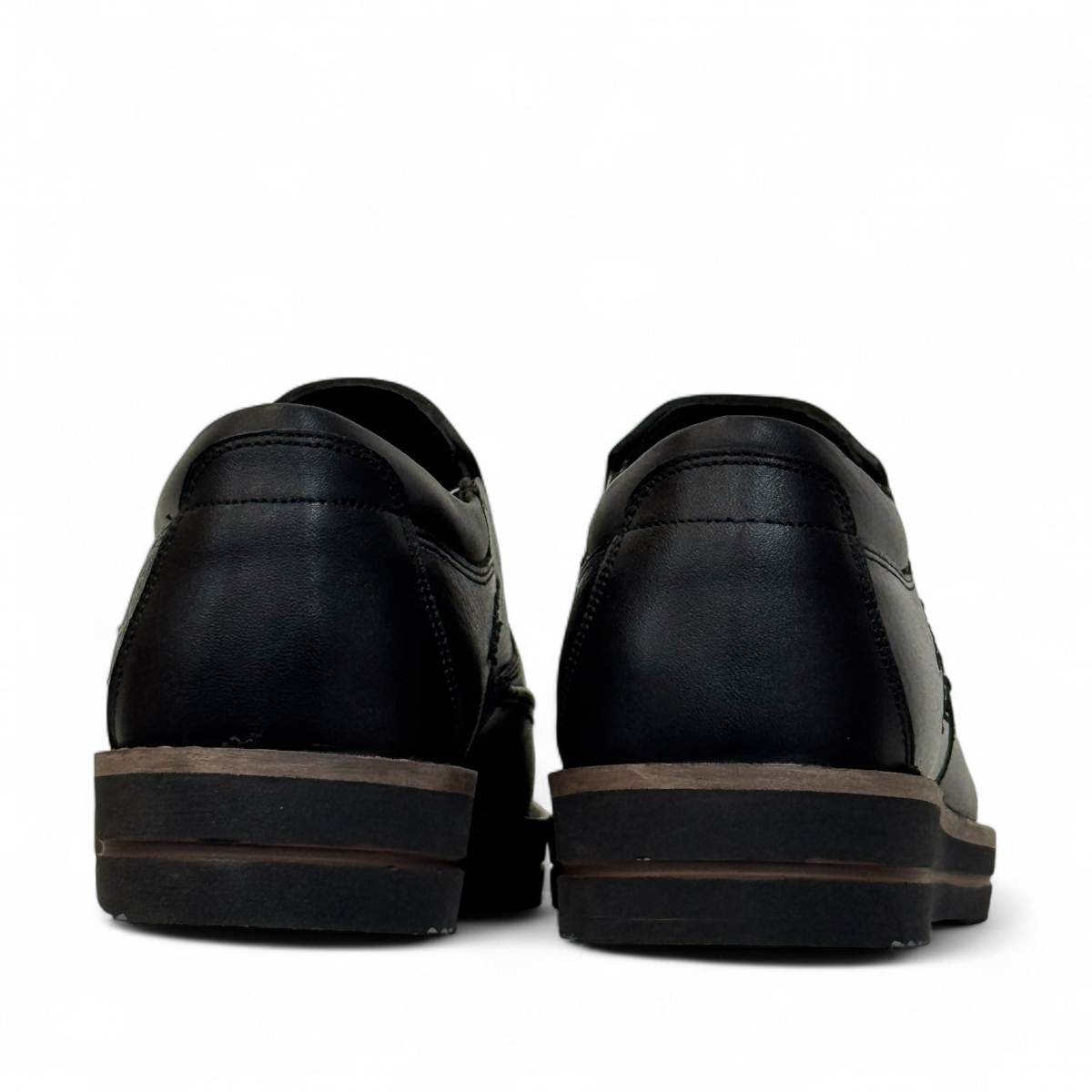 Satel Niavaran black leather slip-on shoes with handmade stitching and durable rubber outsole. Photo of back view.