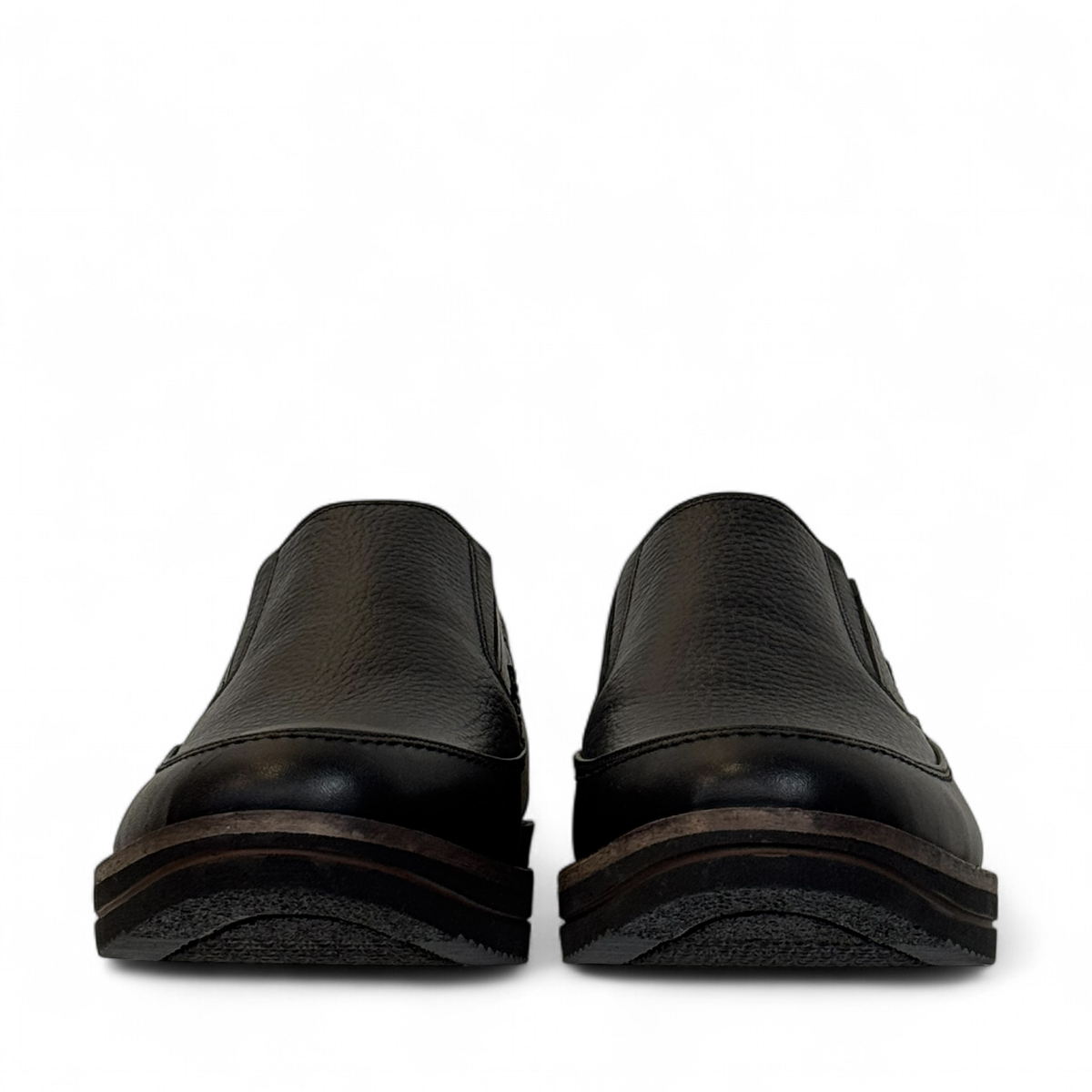 Satel Niavaran black leather slip-on shoes with handmade stitching and durable rubber outsole. Photo of front view.