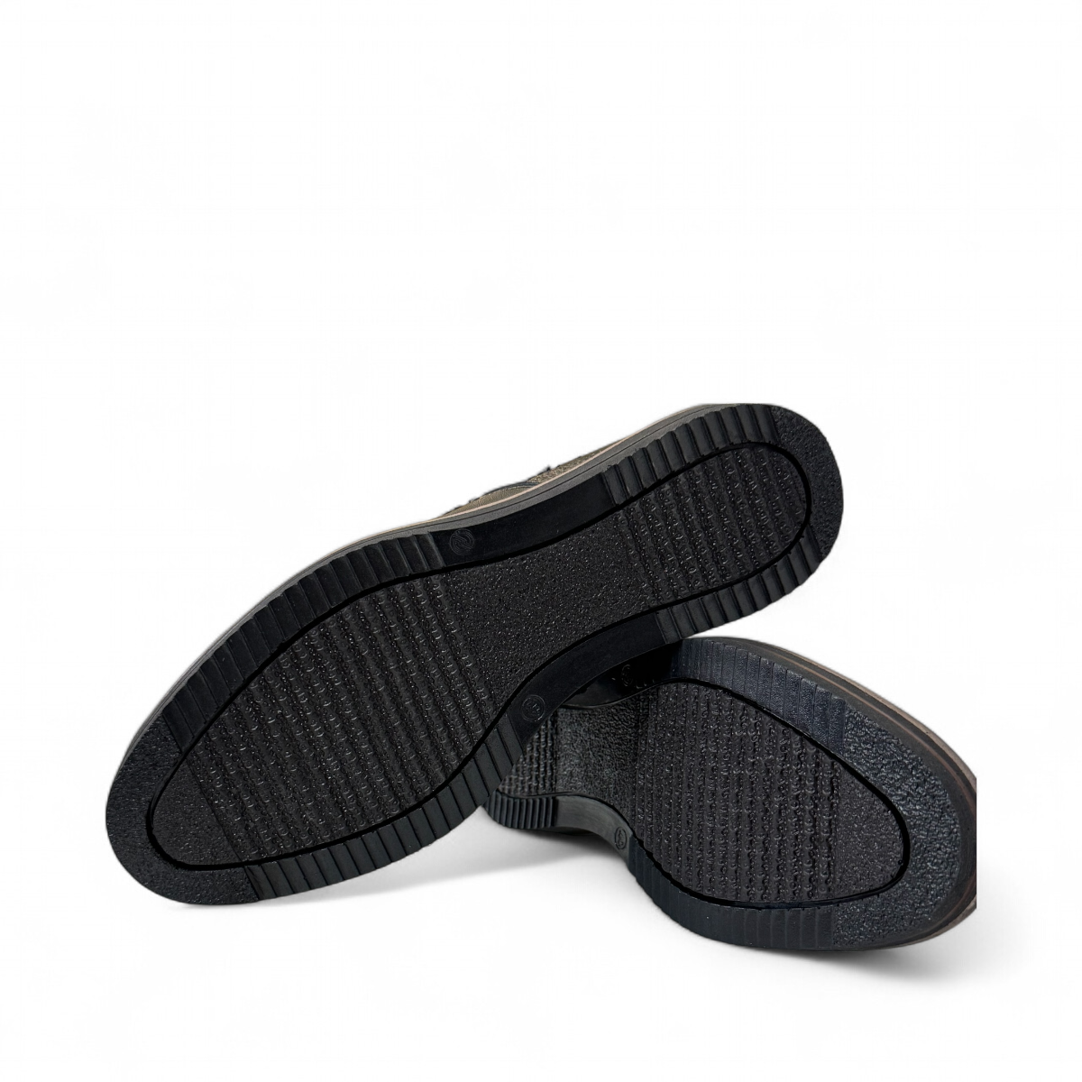 Satel Niavaran black leather slip-on shoes with handmade stitching and durable rubber outsole. Photo of bottom view.