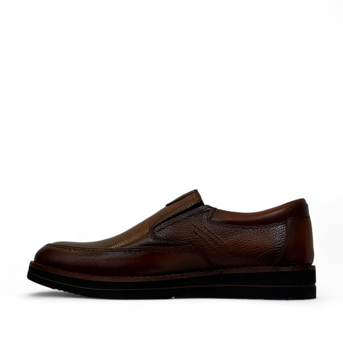 Satel Niavaran brown leather slip-on shoes with handmade stitching and a durable rubber outsole for formal wear. Photo of left side view.