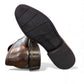 Satel Satani dark brown genuine leather loafers with handmade stitching and a durable rubber outsole. Photo of bottom view.