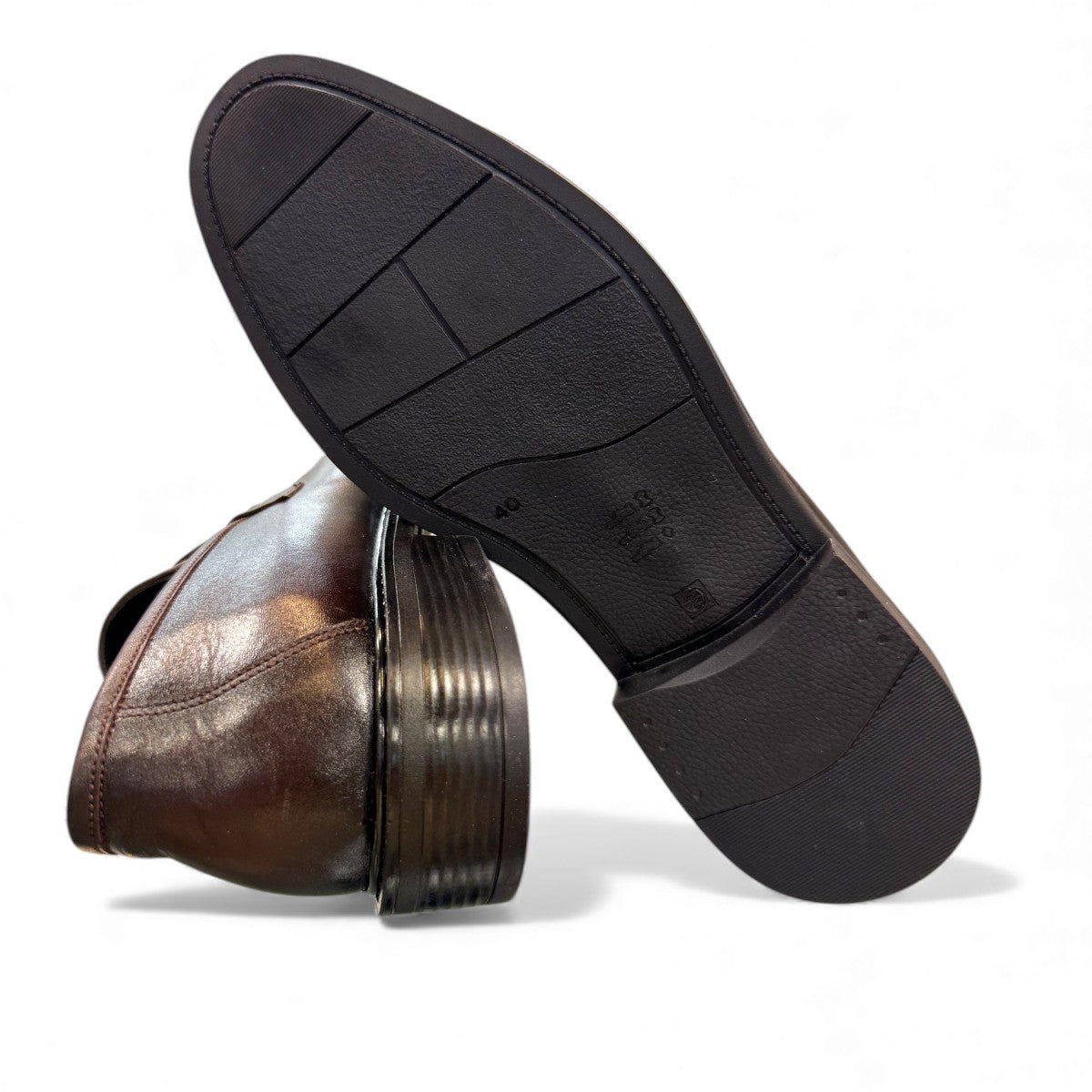 Satel Satani dark brown genuine leather loafers with handmade stitching and a durable rubber outsole. Photo of bottom view.
