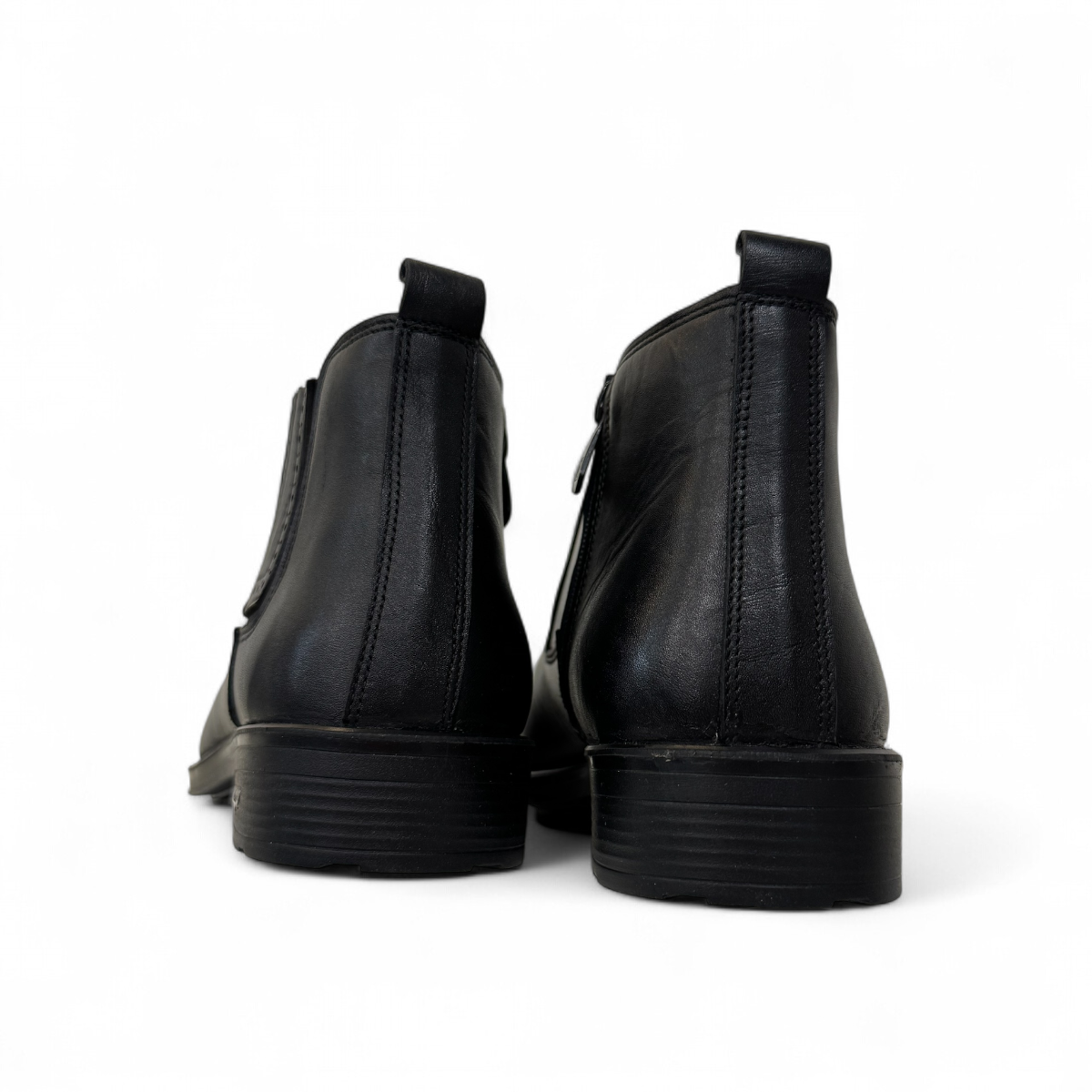 Satel Yazd black leather boots with elastic side panels, handmade stitching, and durable rubber outsole. Photo of back view.