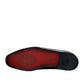 Sun Adriyan maroon patent leather loafers with a textured finish and durable rubber outsole. Photo of bottom view.