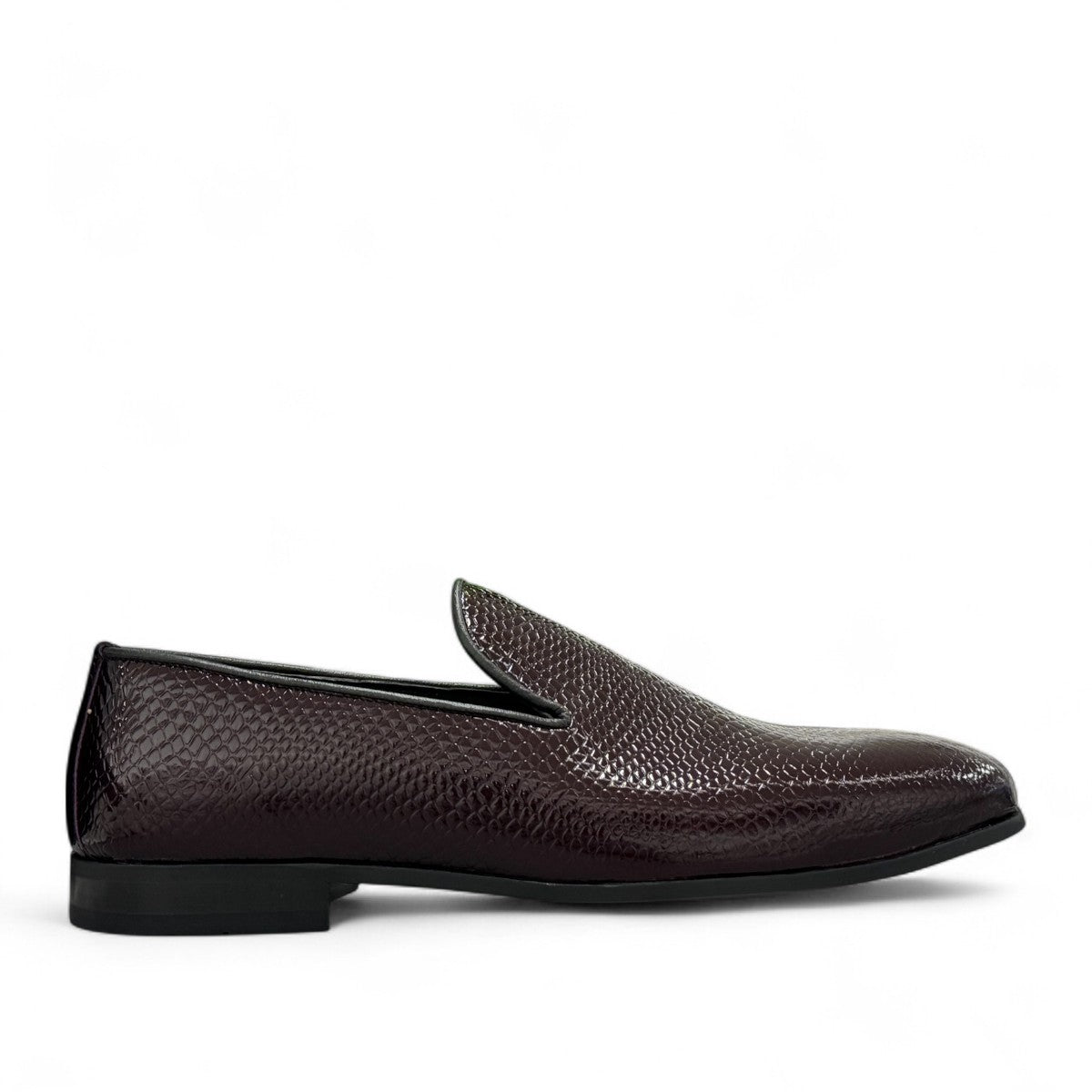 Sun Adriyan maroon patent leather loafers with a textured finish and durable rubber outsole. Photo of outside side view.