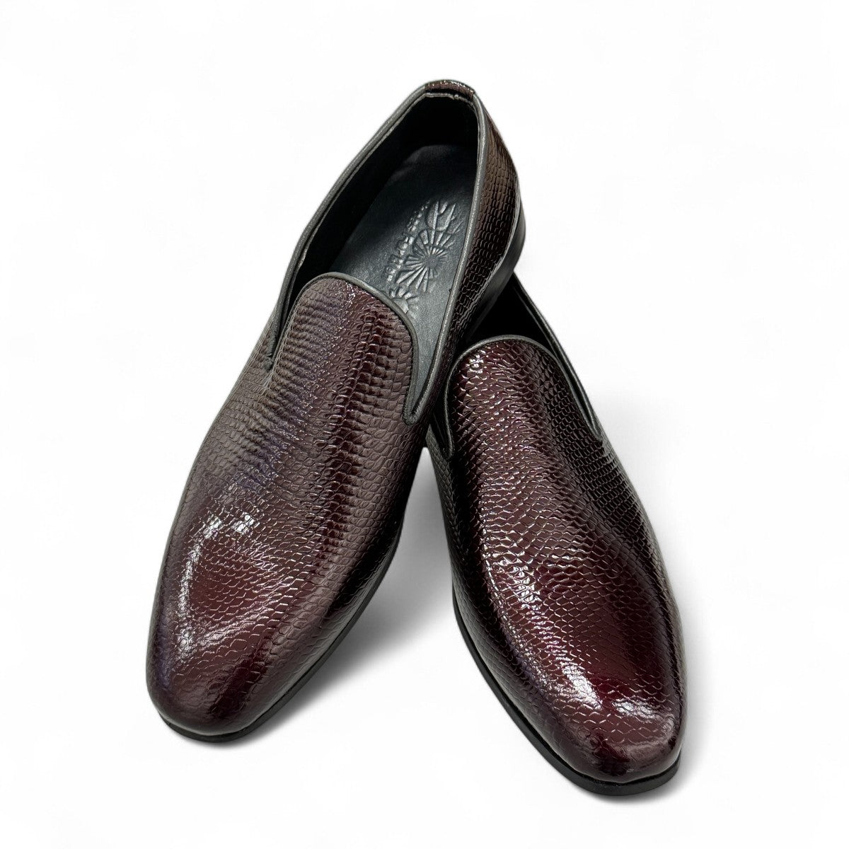 Sun Adriyan maroon patent leather loafers with a textured finish and durable rubber outsole. Photo of upper view.