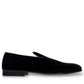 Sun Arash black suede slip-on loafers with subtle handmade stitching and a durable rubber outsole. Photo of outside side view.