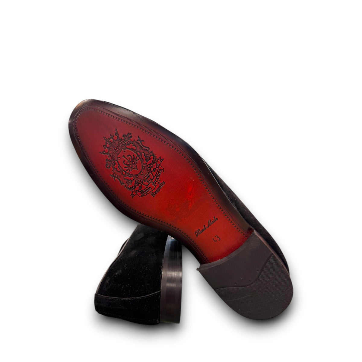 Sun Arash black suede slip-on loafers with subtle handmade stitching and a durable rubber outsole. Photo of bottom view.