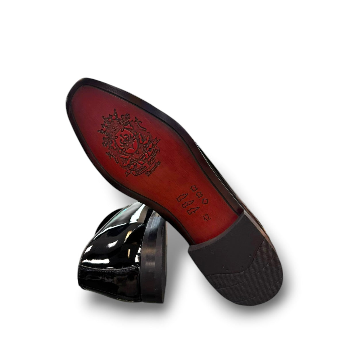 Sun Aron black patent leather loafer with handmade stitching and a durable rubber outsole. Photo of bottom view.