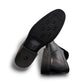 Sun Atar 2 black leather slip-on dress shoe with textured side panel and durable rubber outsole. Photo of bottom view.