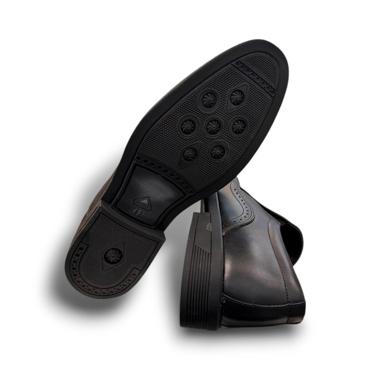 Sun Atar 2 black leather slip-on dress shoe with textured side panel and durable rubber outsole. Photo of bottom view.