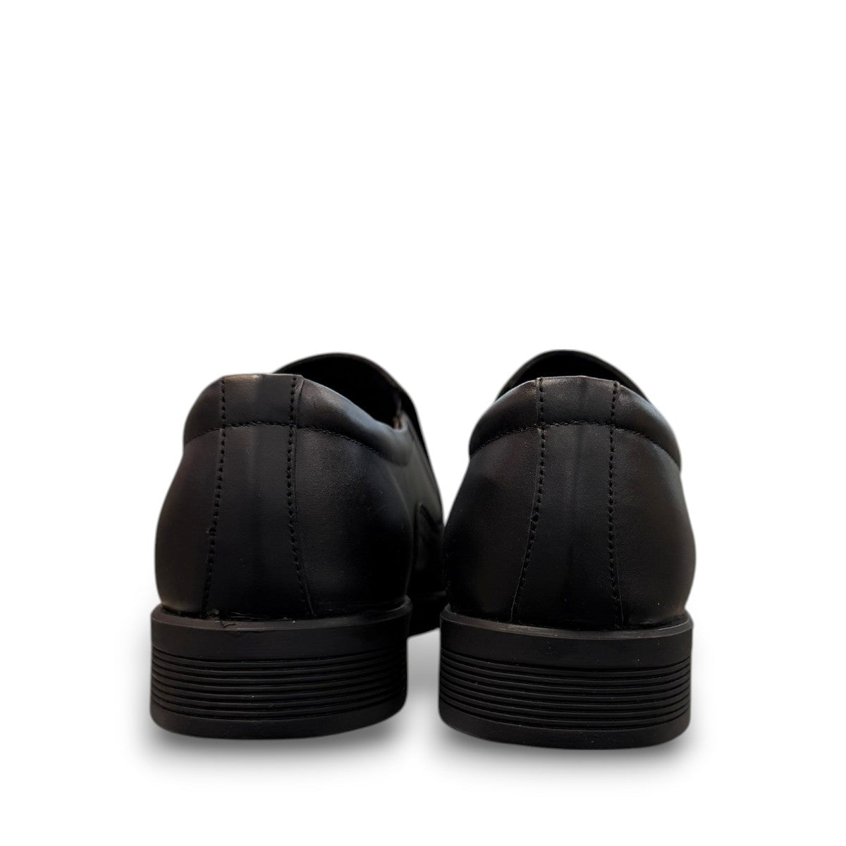 Sun Atar 2 black leather slip-on dress shoe with textured side panel and durable rubber outsole. Photo of back view.