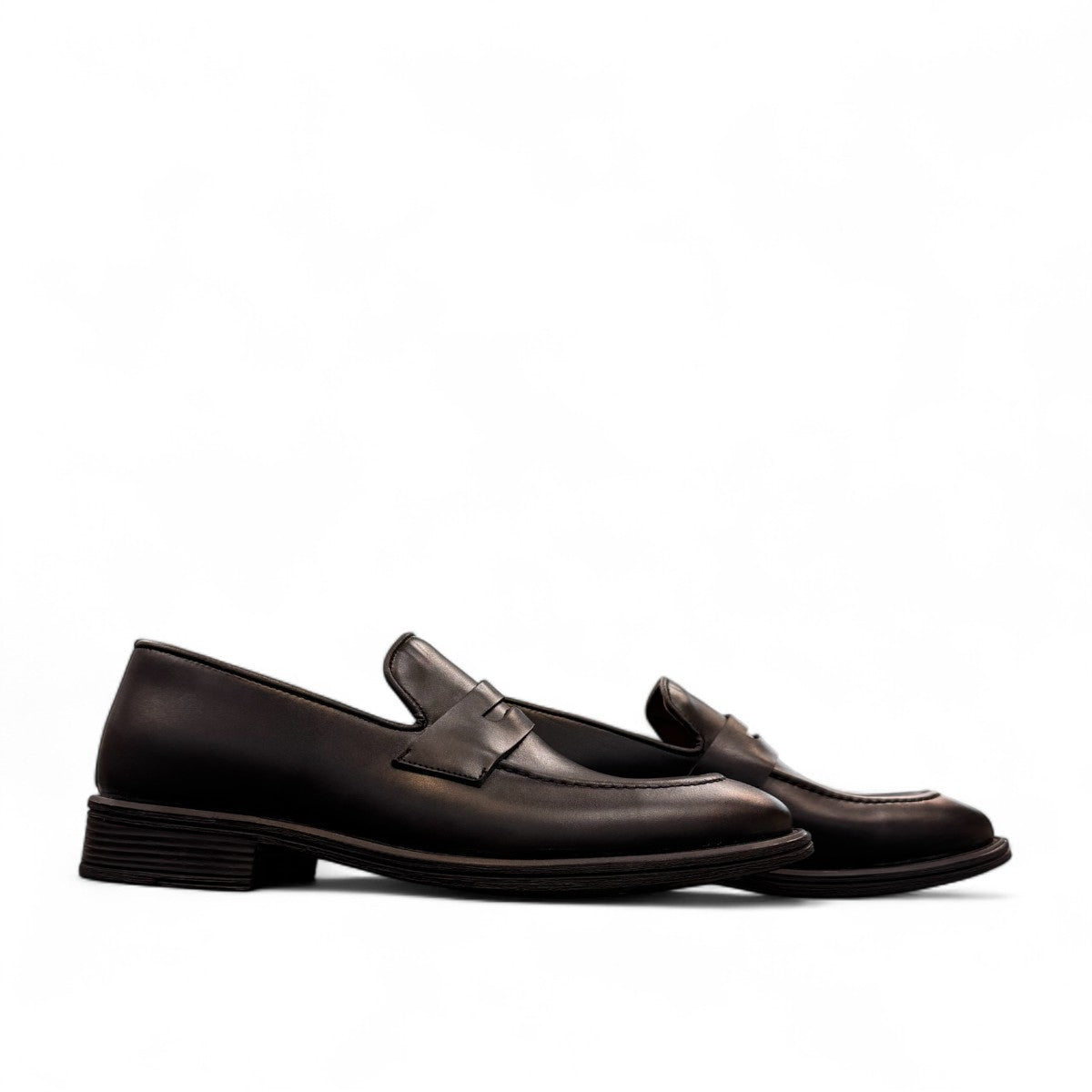 Sun Faulad black leather penny loafer with handmade stitching and durable rubber outsole. Photo of side views.
