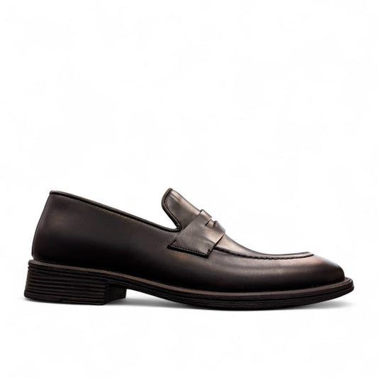 Sun Faulad black leather penny loafer with handmade stitching and durable rubber outsole. Photo of left side view.