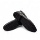 Sun Hesam black leather lace-up boot with a polished finish, rubber outsole, and handmade stitching. Photo of bottom view.