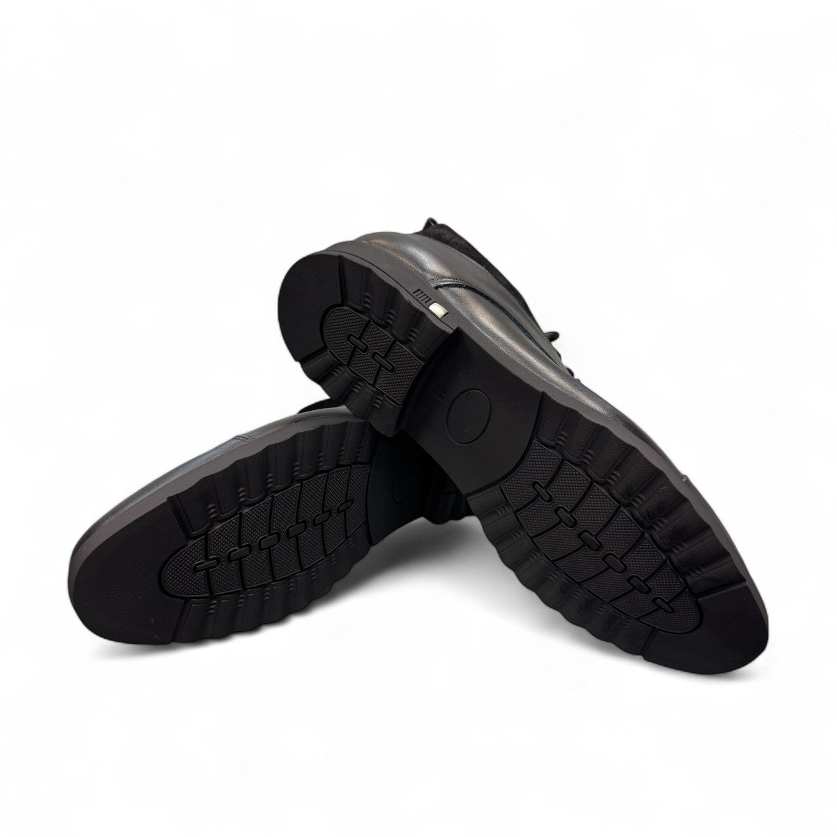 Sun Hesam black leather lace-up boot with a polished finish, rubber outsole, and handmade stitching. Photo of bottom view.