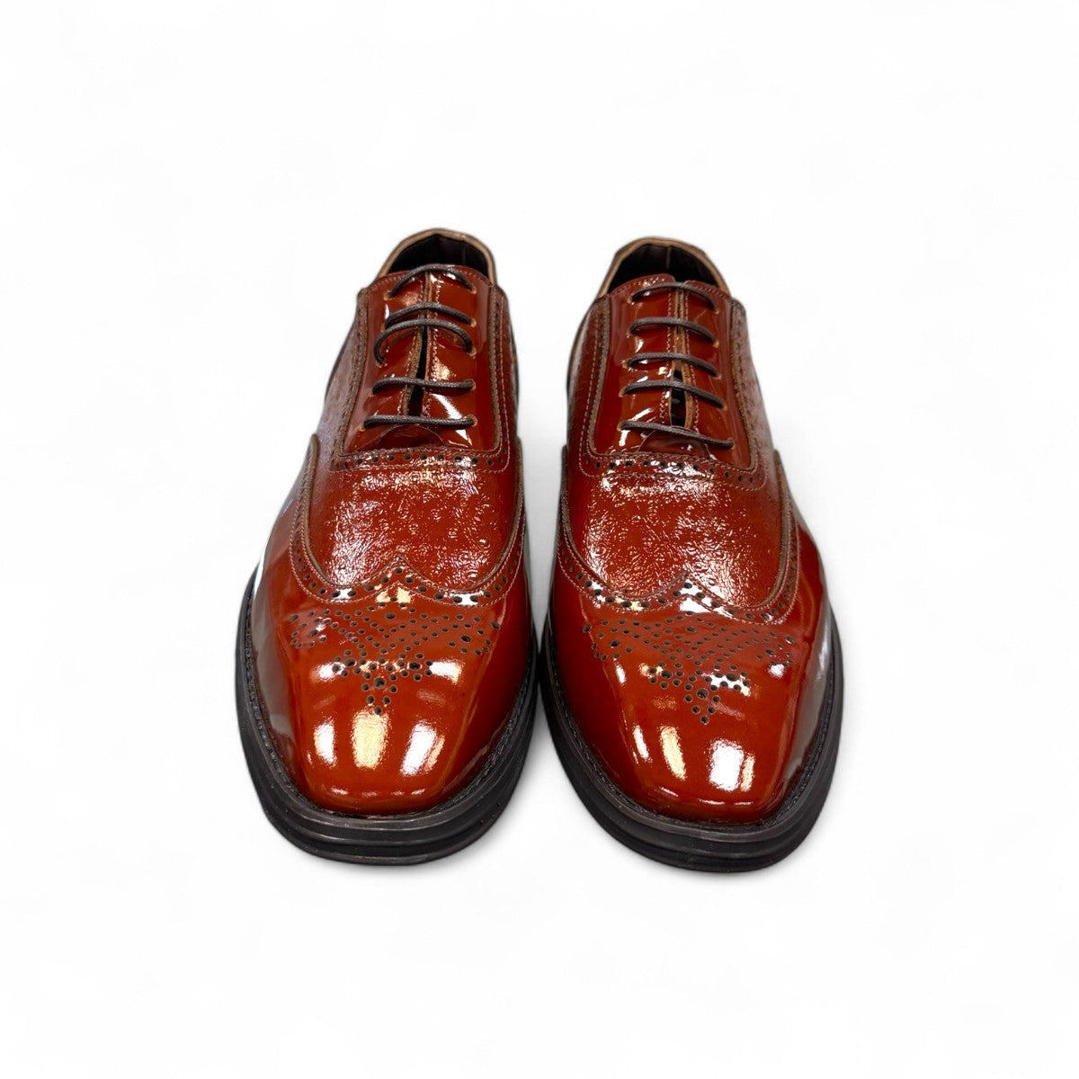 Sun Hesamak 2 brown patent leather lace-up dress shoe with brogue detailing and a durable rubber outsole. Photo of front view.