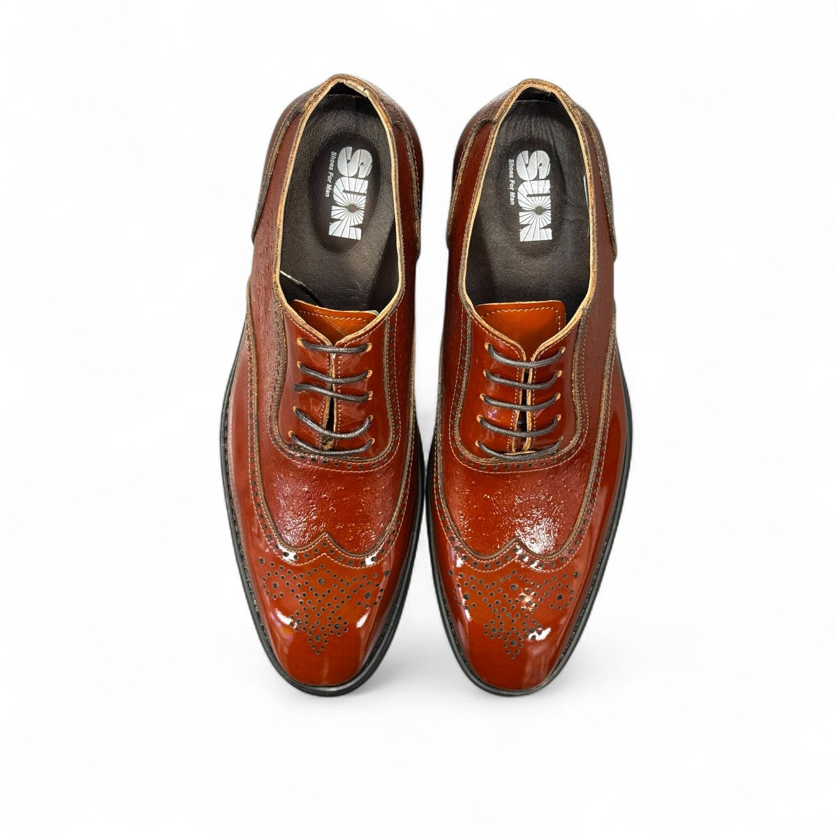 Sun Hesamak 2 brown patent leather lace-up dress shoe with brogue detailing and a durable rubber outsole. Photo of upper view 2.