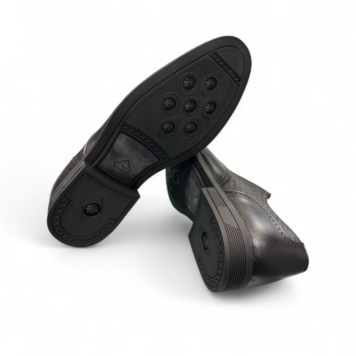Sun Hesamak 3 black leather brogue dress shoe with lace-up closure and detailed stitching. Photo of bottom view.