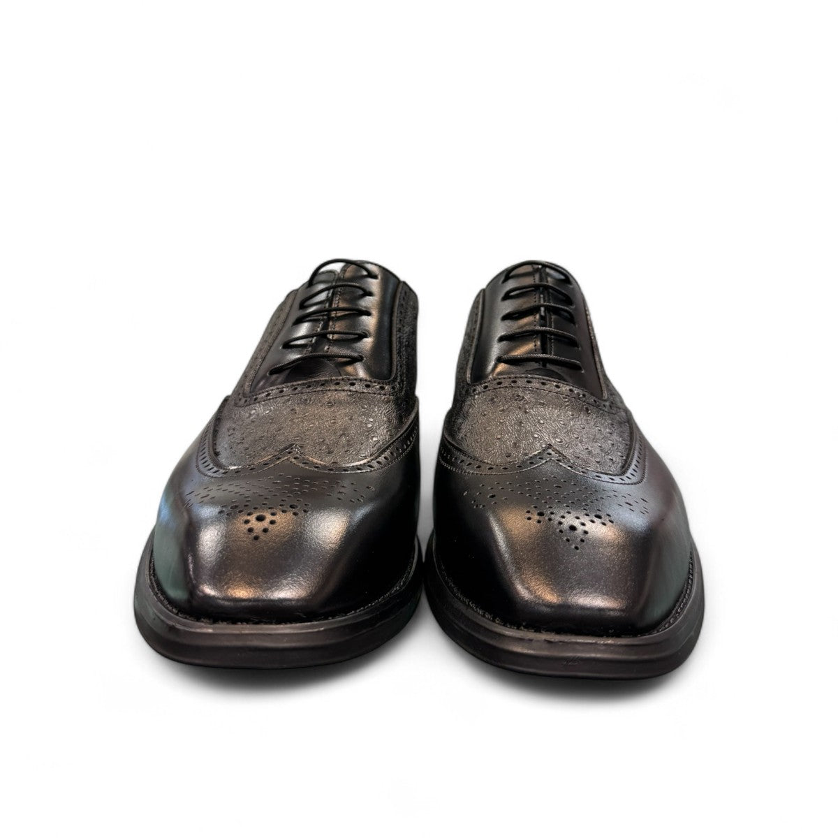 Sun Hesamak 3 black leather brogue dress shoe with lace-up closure and detailed stitching. Photo of front view 1.