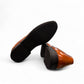 Sun Hesamak brown leather shoe with lace-up closure, textured side panel, and detailed stitching. Photo of bottom view.