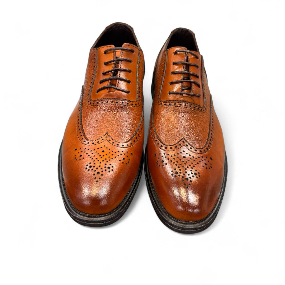 Sun Hesamak brown leather shoe with lace-up closure, textured side panel, and detailed stitching. Photo of front view.