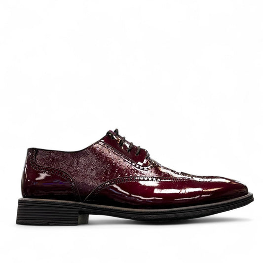 Sun Hesamak red leather brogue shoe with lace-up closure, polished finish, and durable rubber outsole. Photo of left side.