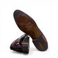 Sun Keyhan red patent leather lace-up formal shoe with textured heel detail and rubber outsole. Photo of bottom view.