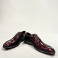 Sun Keyhan red patent leather lace-up formal shoe with textured heel detail and rubber outsole. Photo of front view 2.